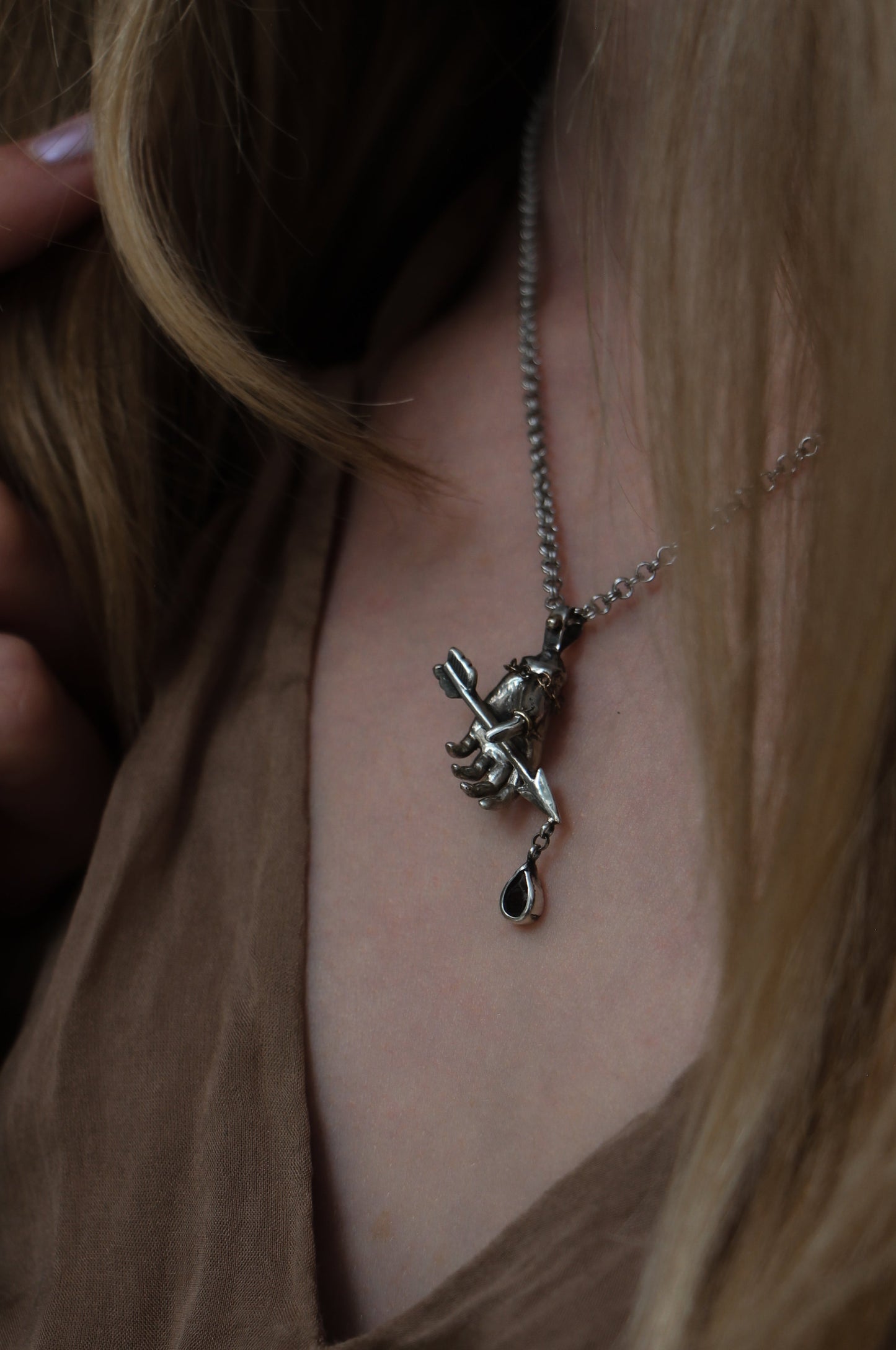 RELICS armors arrow hand necklace with garnet drop