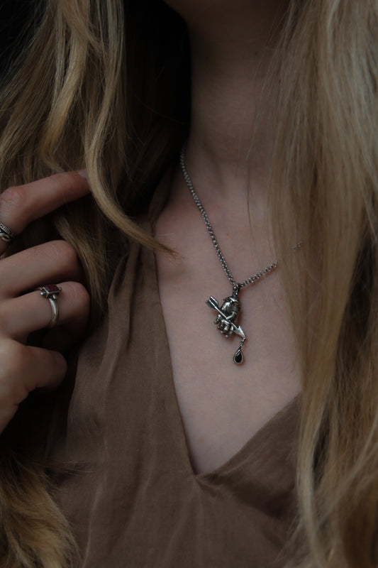 RELICS armors arrow hand necklace with garnet drop