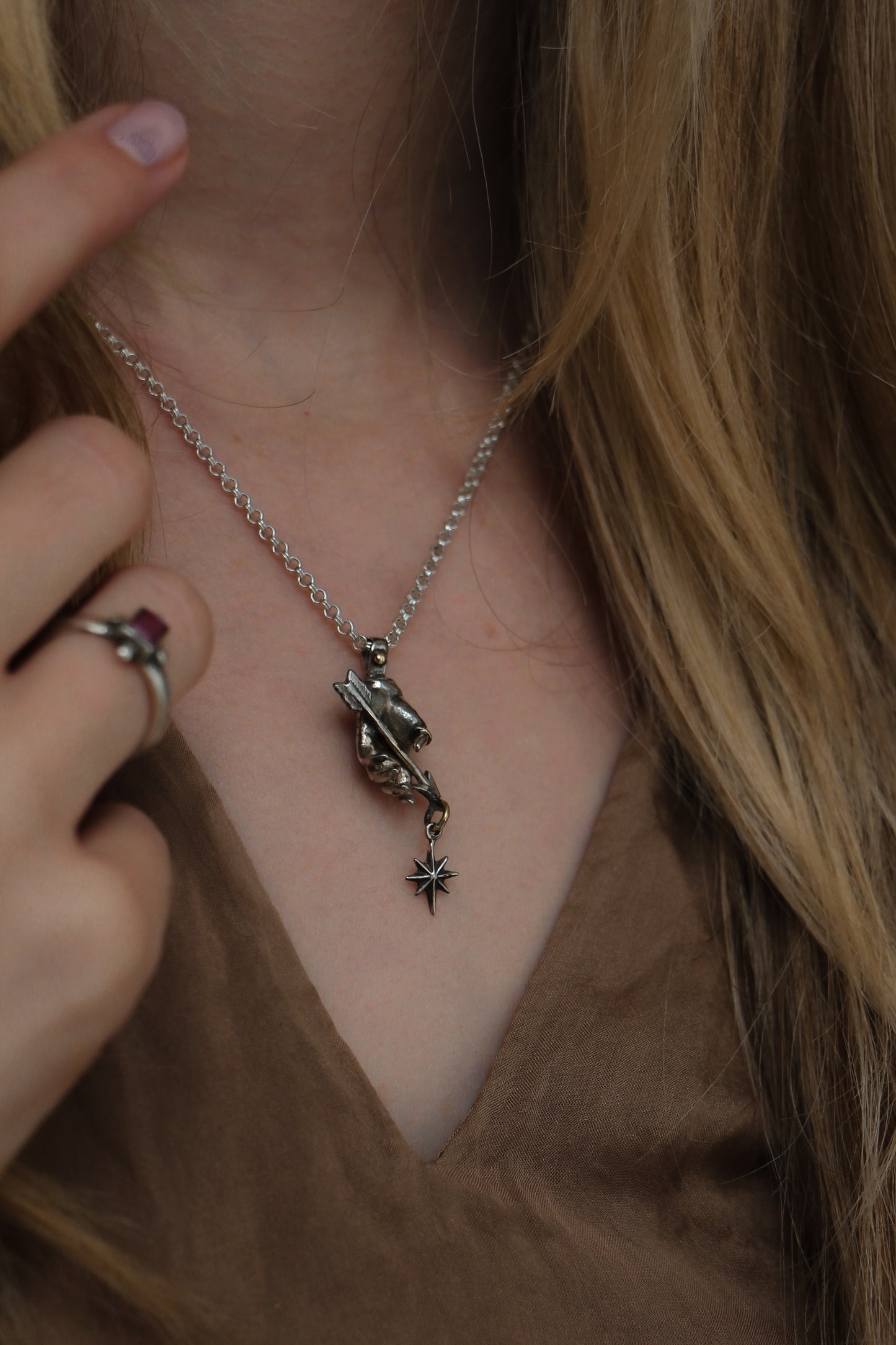 victorian style hand pendant with star and arrow