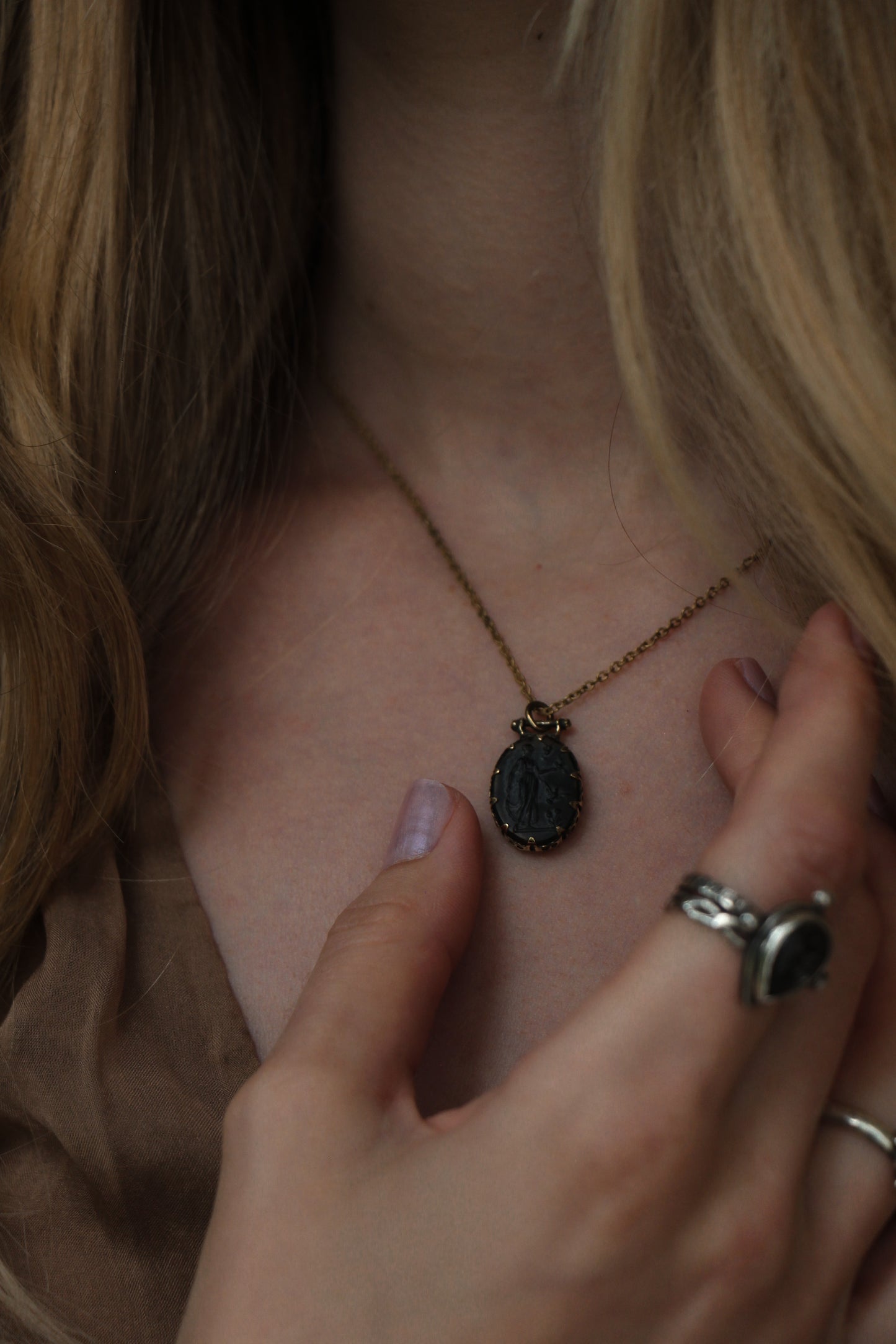 black glass cameo necklace with nymph image