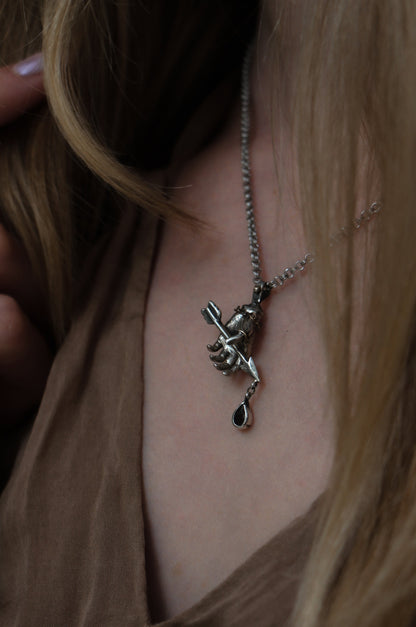 RELICS armors arrow hand necklace with garnet drop