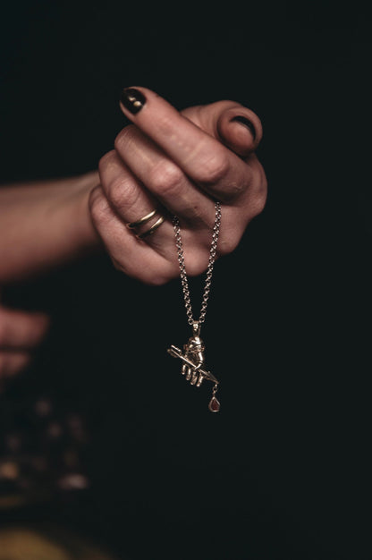 RELICS armors arrow hand necklace with garnet drop