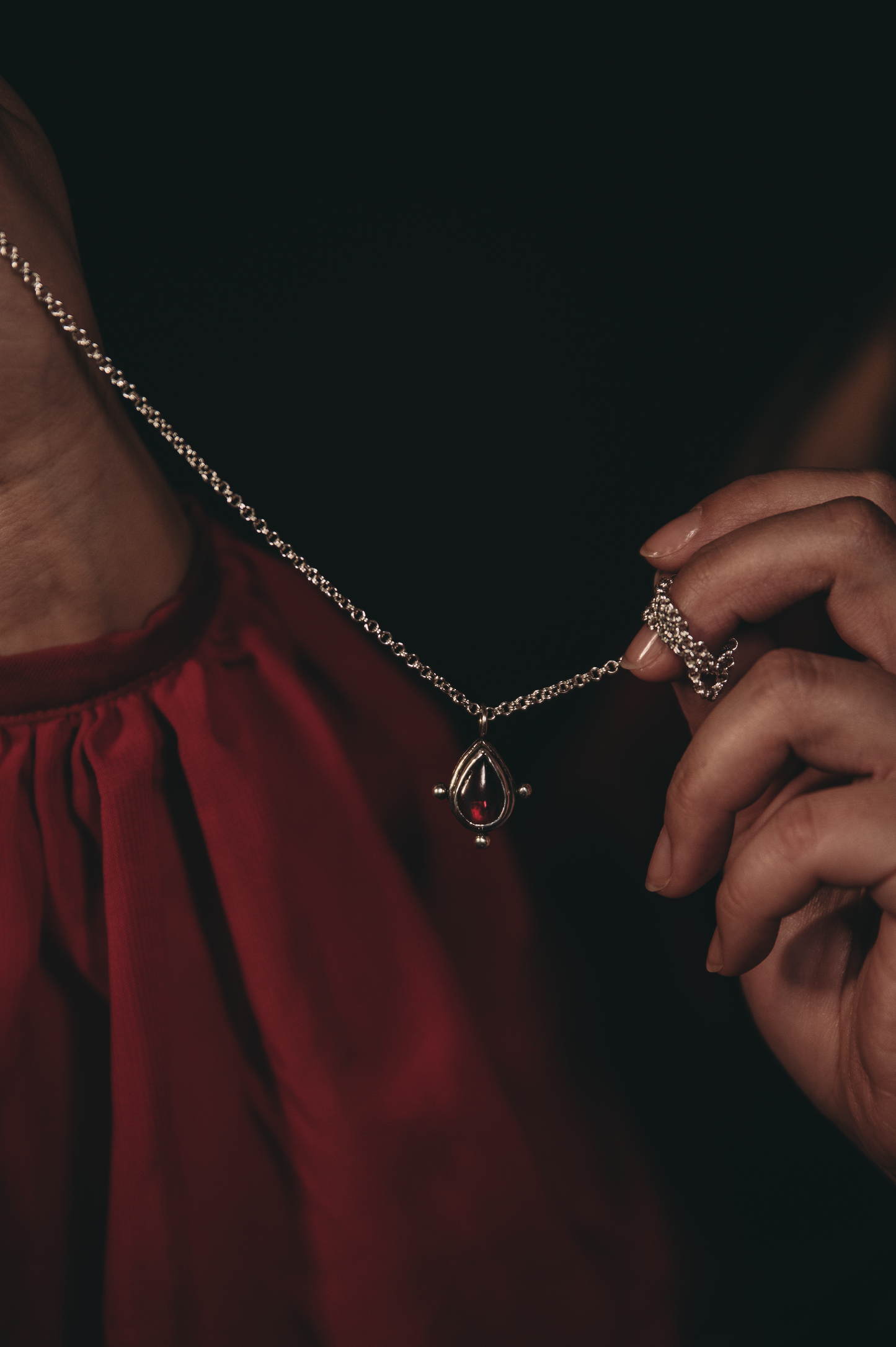 Sterling silver necklace with garnet drop pendant