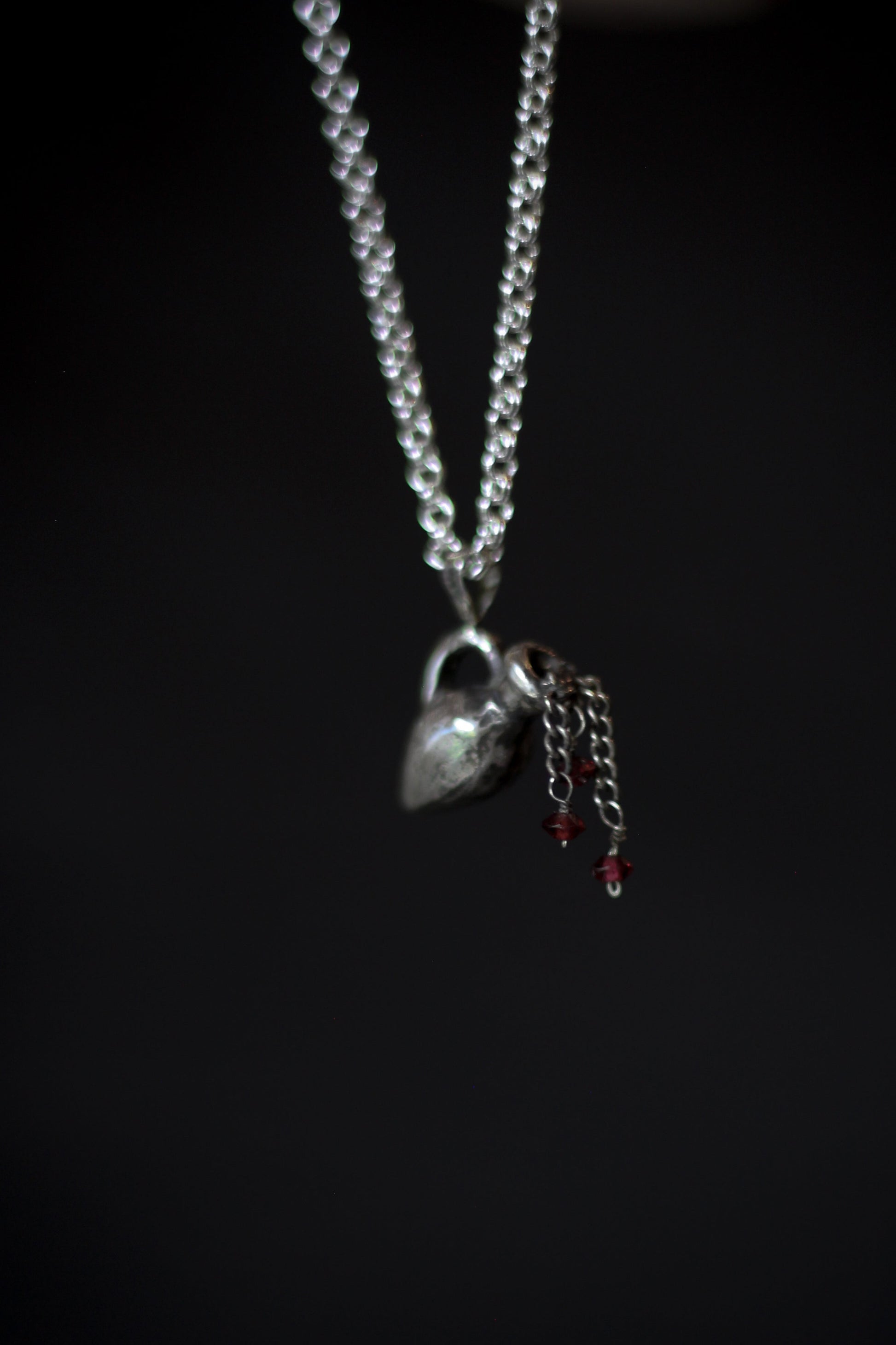 Aquarius sterling silver necklace with garnet drops