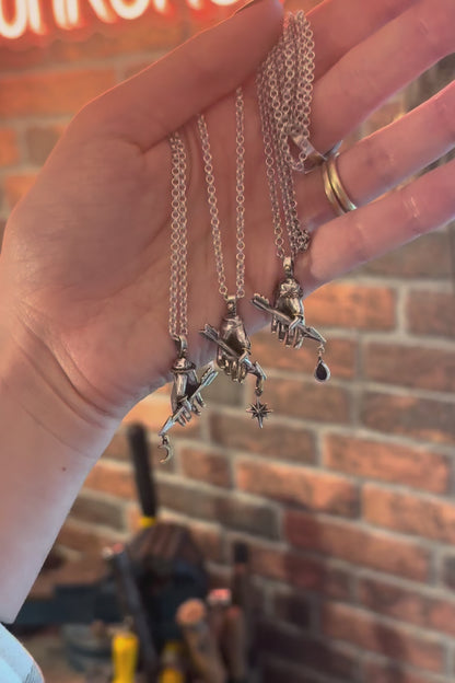 three victorian style hand pendants on silver chains
