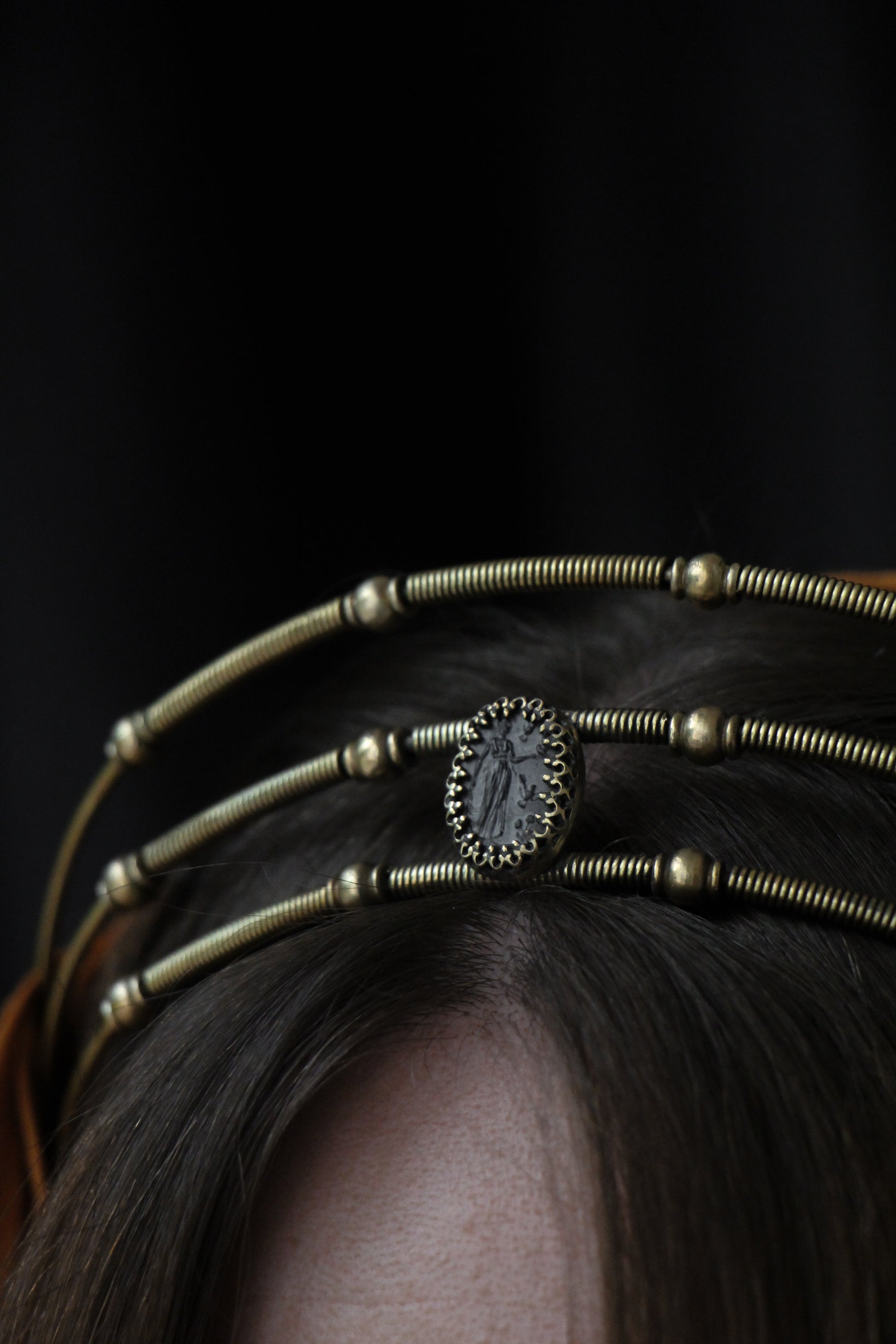 details of roman inspired brass crown with black vintage glass cameo depicting nymph from 1930